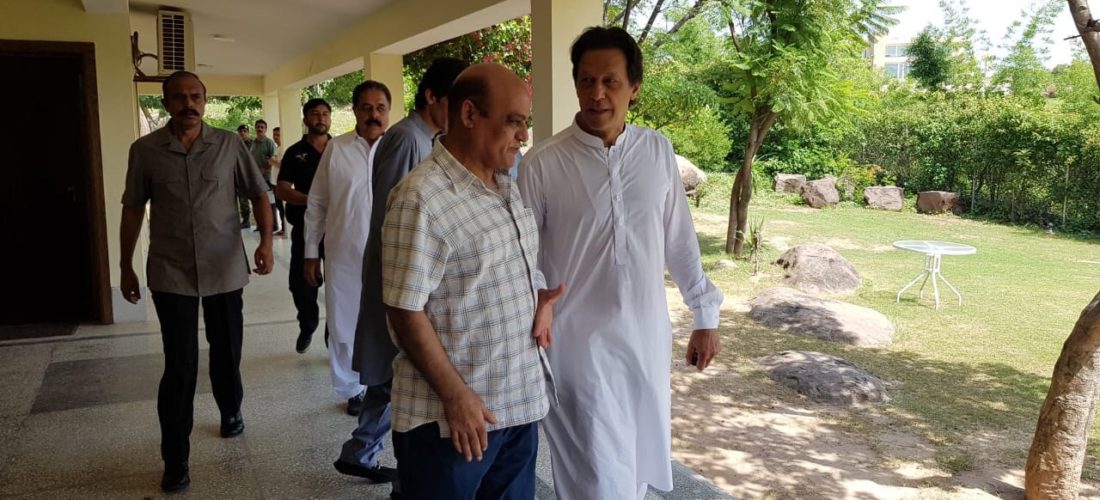 Tahir Anjum with future Prime Minister and Pervez Khattak on Aug. 01 at Bani Gala